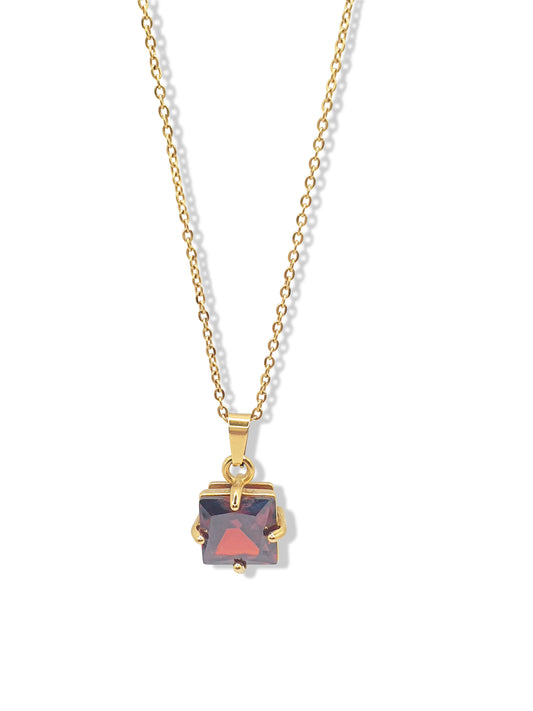 Gold necklace with a red square crystal pendant