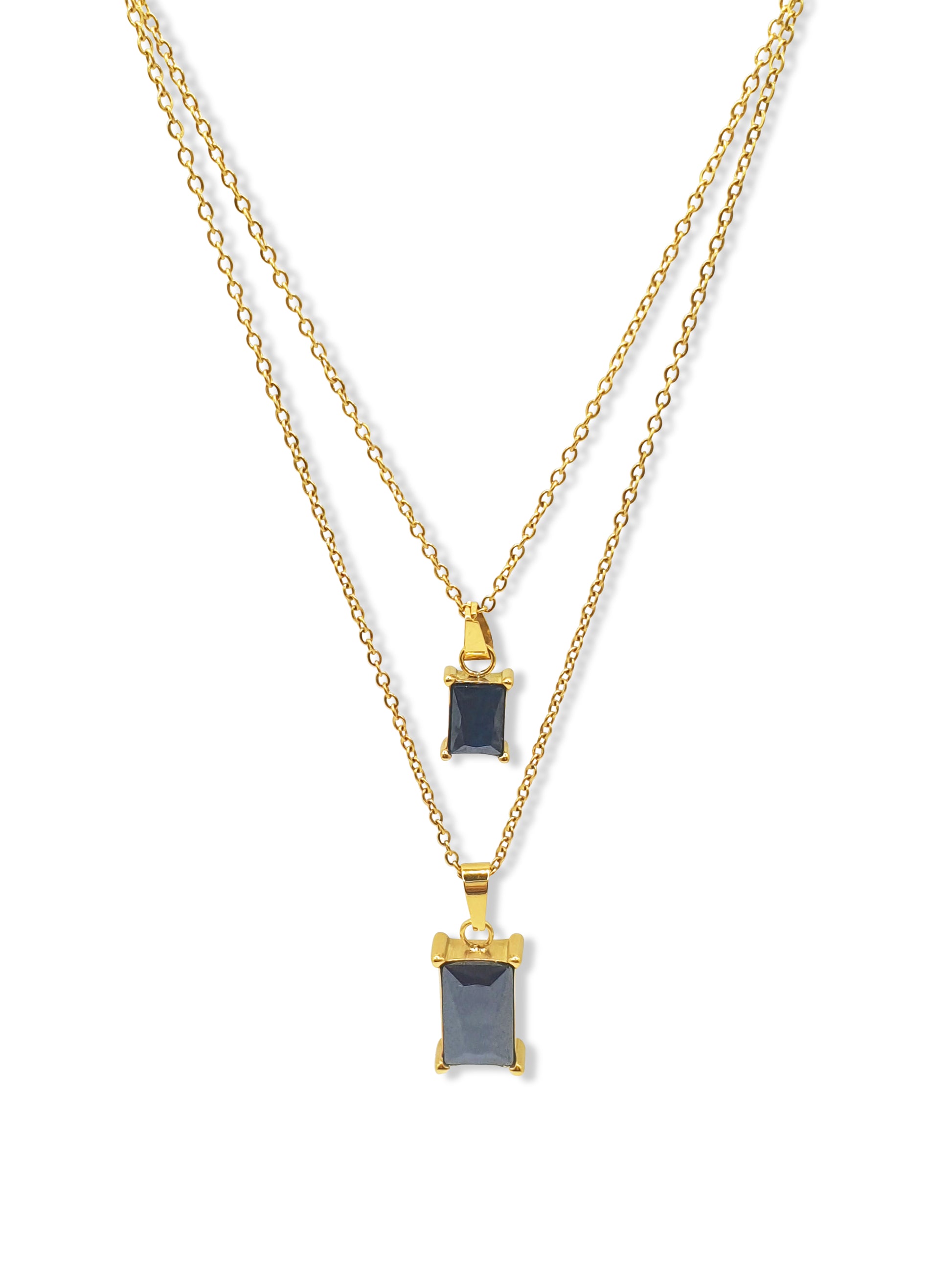 A gold double layered necklace with black rectangle jewel pendants