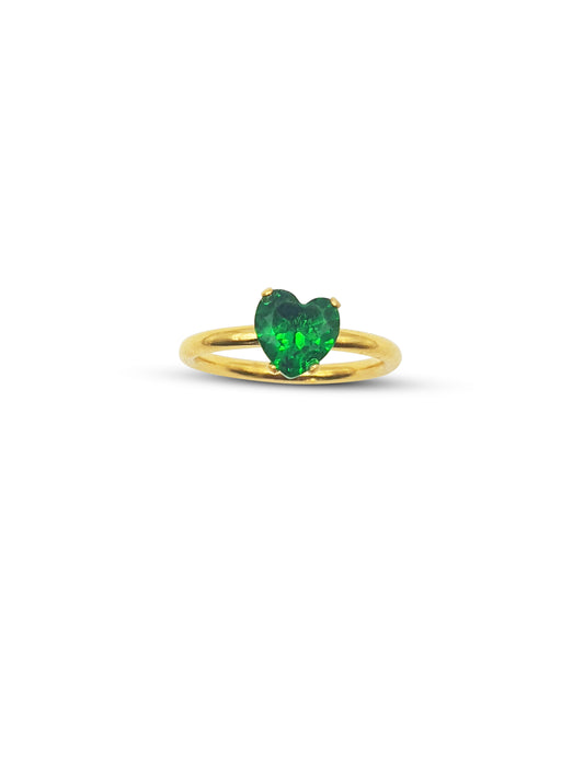 Gold band ring with a green heart gem