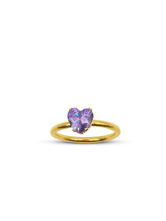 Gold band ring with a purple heart gem
